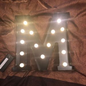 Light up metal letter M